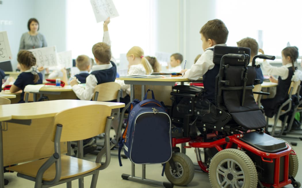 A disabled student in a wheelchair in primary school.