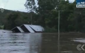 Man describes rescue of Queensland 'floating house' family