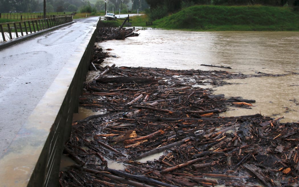 Wigan Bridge on Tauwhareparae Road out of Tolaga Bay became clogged with woody debris on Tuesday before it has now been cleared.