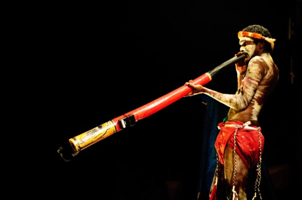 Aboriginal man playing the didgeridoo