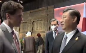 Chinese president Xi Jinping and Canadian Prime Minister Justin Trudeau during an informal chat at the G20 summit.